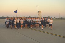 MINOT AIR FORCE BASE, N.D. -- The 5th Civil Engineer Squadron closes in on the finish line during a group flightline run as part of wingman day here Sept. 18. The 5th Bomb Wing event, which coincided with the Air Force’s 62nd birthday, was held as a means to strengthen  the morale and welfare of each unit by empowering and encouraging Airmen to not only become great wingmen, but future leaders. (U.S. Air Force photo by Senior Airman Wesley Wright)