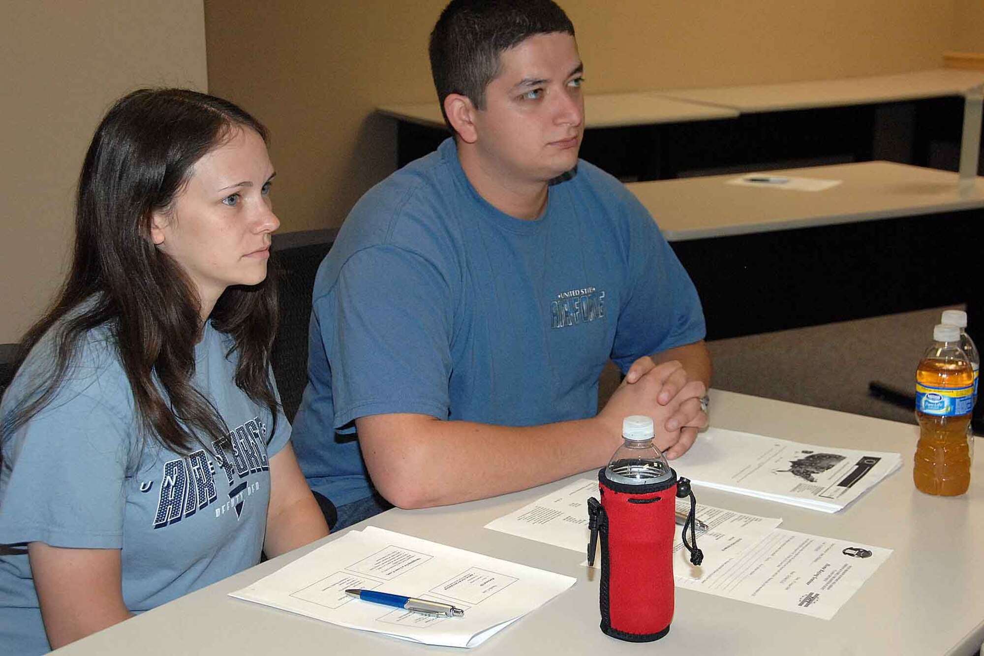 OFFUTT AIR FORCE BASE, Neb .--- Staff Sgt. Michael Chase, 2nd Systems Operations Squadron and his wife Melissa, listen to the home-buying workshop presentation at the Airman and Family Readiness Center here Aug. 27. The workshop covered numerous aspects of buying a home including financing, closing costs and government programs. U.S. Air Force Photo by Kendra Williams