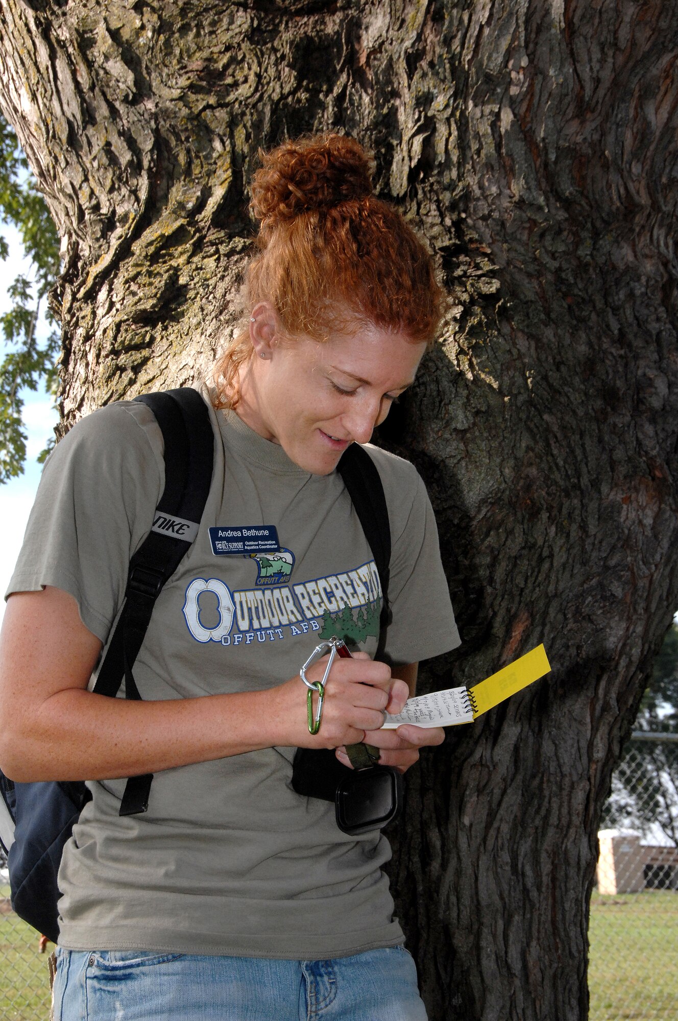 OFFUTT AIR FORCE BASE, Neb. -- Andrea Bethune, an aquatics coordinator for the 55th Force Support Squadron, documents her findings during a Volksport Walk/Run here Sept. 19. The event was held on Offutt and in parts of Bellevue, Neb. U.S. Air Force Photo by D.P. Heard