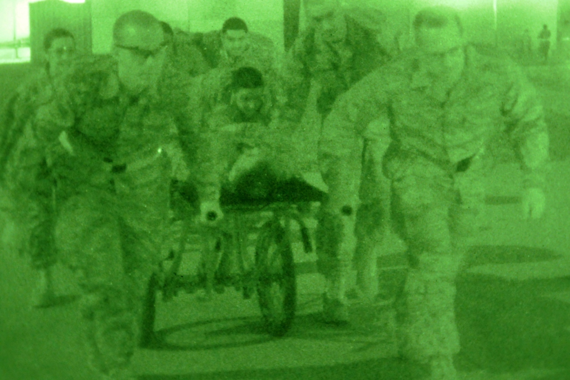 KIRKUK REGIONAL AIR BASE, Iraq -- Members of the 506th Expeditionary Medical Squadron, manpower team, transport a patient to a UH-60 Black Hawk helicopter during a medical evacuation training exercise here Sept. 3.  The Airmen sharpened their skills for treating and preparing trauma patients to be airlifted to the Air Force Theater Hospital at Joint Base Balad, Iraq.  (U.S. Air Force photo/Staff Sgt. Joshua Breckon)

