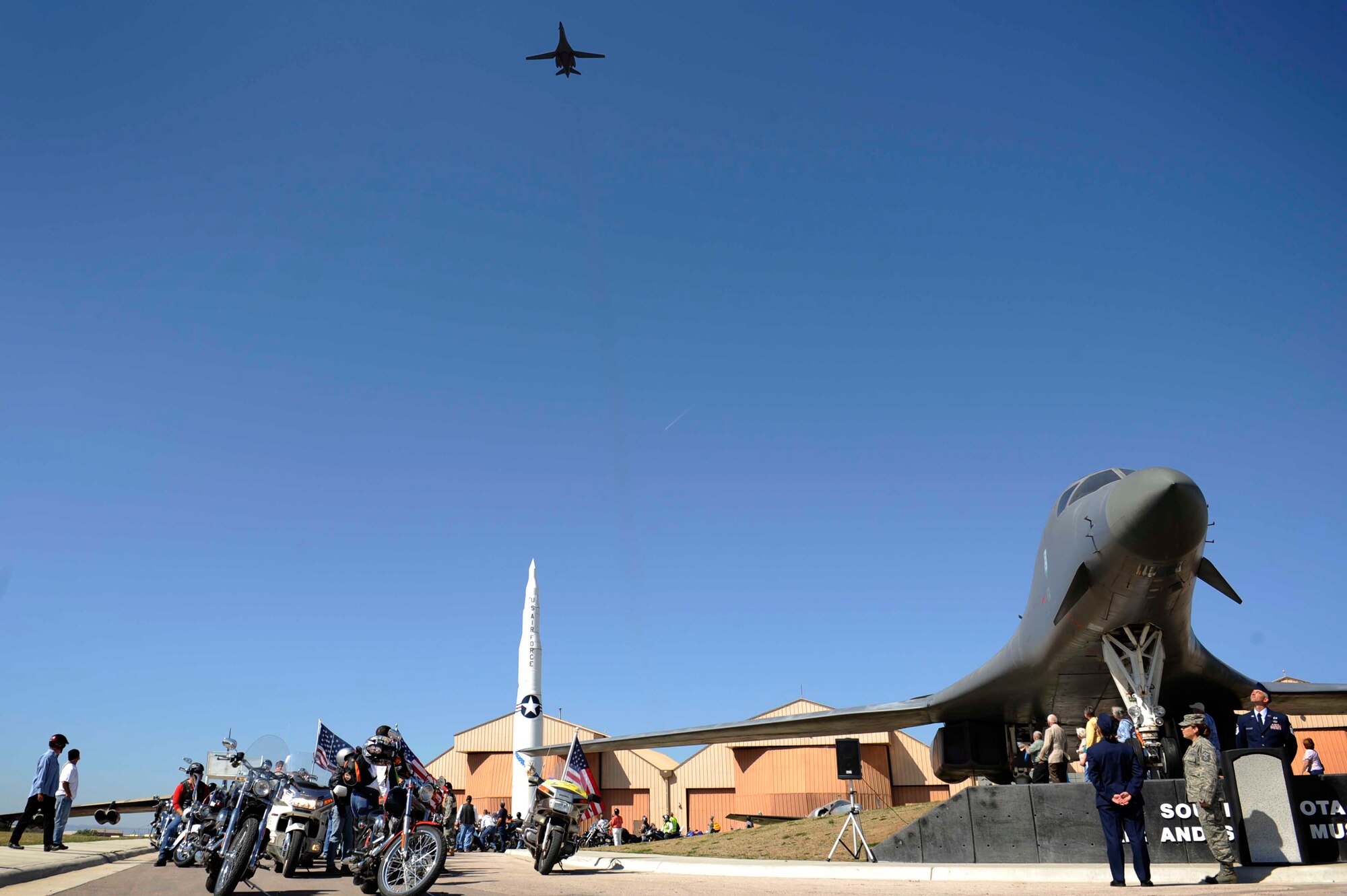 A B-1B Lancer performs a flyover during the Prisoners of War/Missing in Action Remembrance Day at the South Dakota Air and Space Museum Sept. 18. The entire day was dedicated to remembering servicemembers taken as prisoners of war or missing in action. (U.S. Air Force photo by Airman 1st Class Corey Hook)