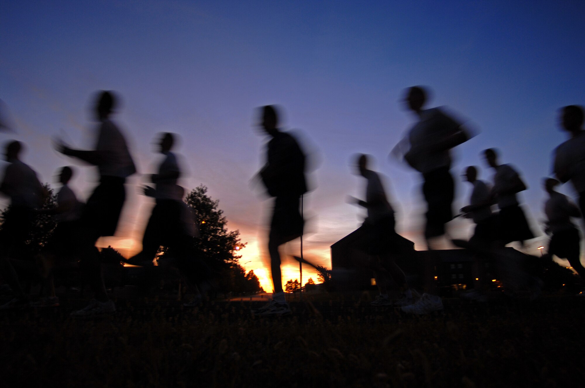 WHITEMAN AIR FORCE BASE, Mo. - The morning sun begins to creep over the horizon as 509th Security Forces Squadron members begin the first leg of a POW/MIA run, Sept. 18. The POW/MIA run is a 24-hour torch and flag run to honor prisoners of war and missing-in-action personnel. Staff Sgts. Amir Hasan and Brandon Lines, 509th Munitions Squadron, organized the 24-hour run and scheduled it to kick off at 6 a.m. the morning of the Air Forces 62nd anniversary. Several military and civilian personnel from 24 different organizations participated in the run. (U.S. Air Force photo/Senior Airman Kenny Holston)
