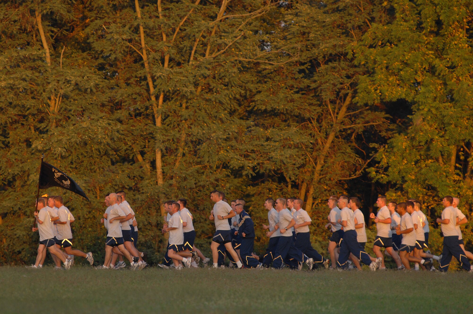 WHITEMAN AIR FORCE BASE, Mo. - Members of the 509th Maintenance Group, reach their two mile mark of the POW/MIA run, Sept. 18. The POW/MIA run is a 24-hour torch and flag run to honor prisoners of war and missing-in-action personnel. Staff Sgts. Amir Hasan and Brandon Lines, 509th Munitions Squadron, organized the 24-hour run and scheduled it to kick off at 6 a.m. the morning of the Air Forces 62nd anniversary. Several military and civilian personnel from 24 different organizations participated in the run. (U.S. Air Force photo/Senior Airman Kenny Holston)