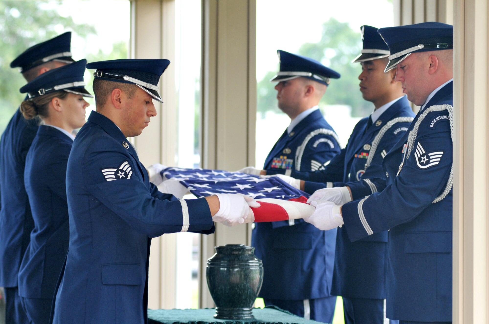 Honor guard members fold the flag at the interment of Tuskegee Airman Robert Decatur at Biloxi National Cemetery Sept. 3.  (U.S. Air Force photo by Adam Bond)