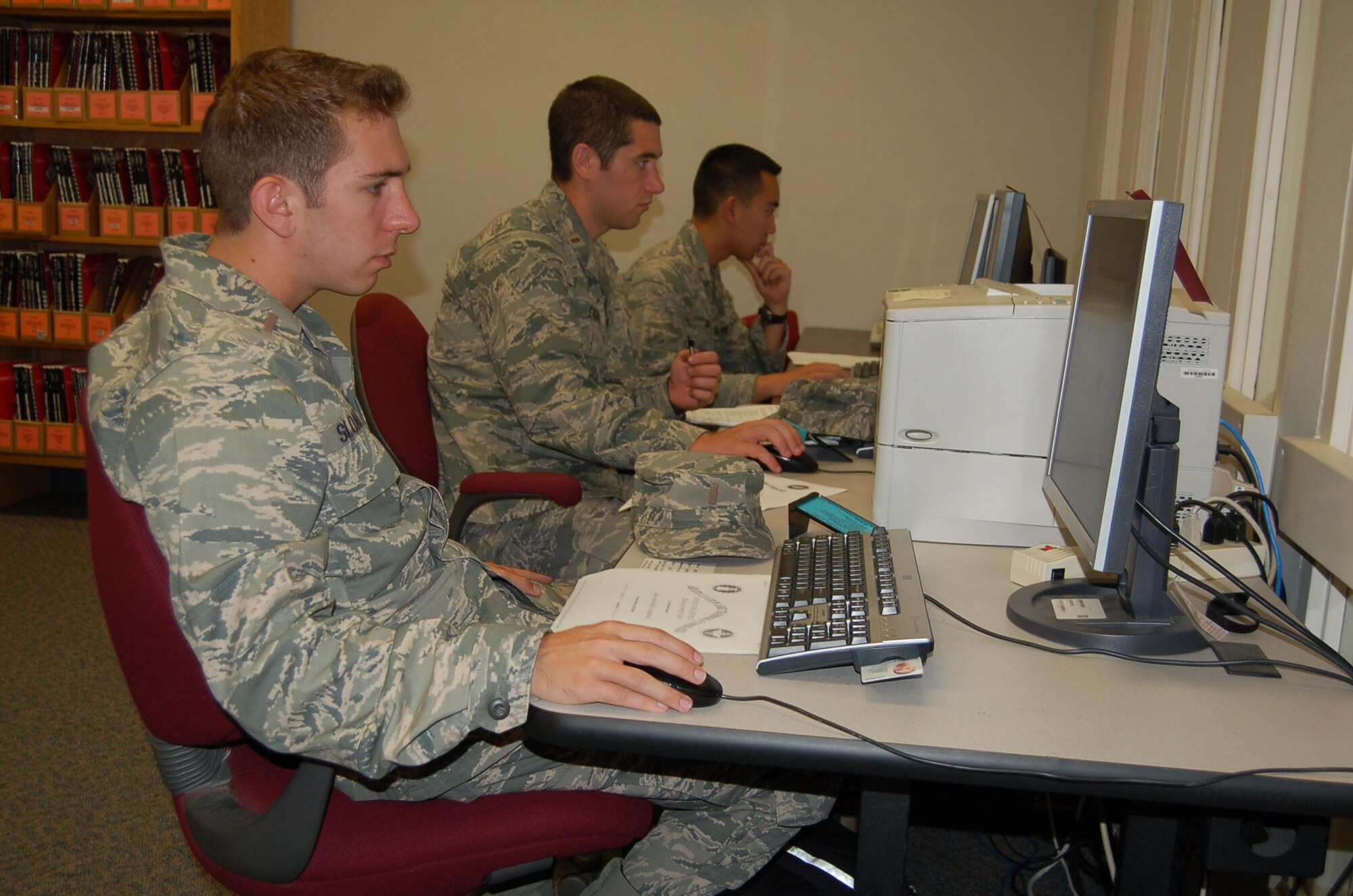 Airmen use computers at the Peterson library Sept. 16. The library received the Department of Defense Morale, Welfare and Recreation Premier Status Award at an annual DoD library workshop in July. The library is one of seven throughout the Air Force to be honored with the award. The library offers 18 computer stations with commercial Internet access and Wi-Fi amongst its many resources. (Air Force photo by Thea Skinner)