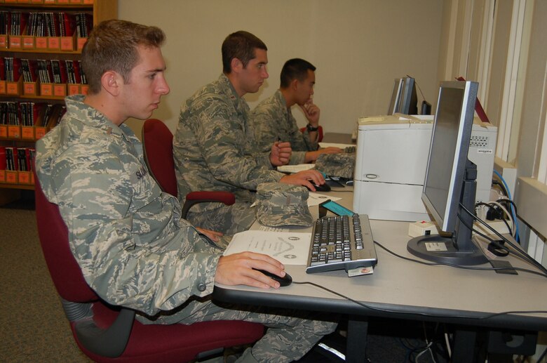 Airmen use computers at the Peterson library Sept. 16. The library received the Department of Defense Morale, Welfare and Recreation Premier Status Award at an annual DoD library workshop in July. The library is one of seven throughout the Air Force to be honored with the award. The library offers 18 computer stations with commercial Internet access and Wi-Fi amongst its many resources. (Air Force photo by Thea Skinner)