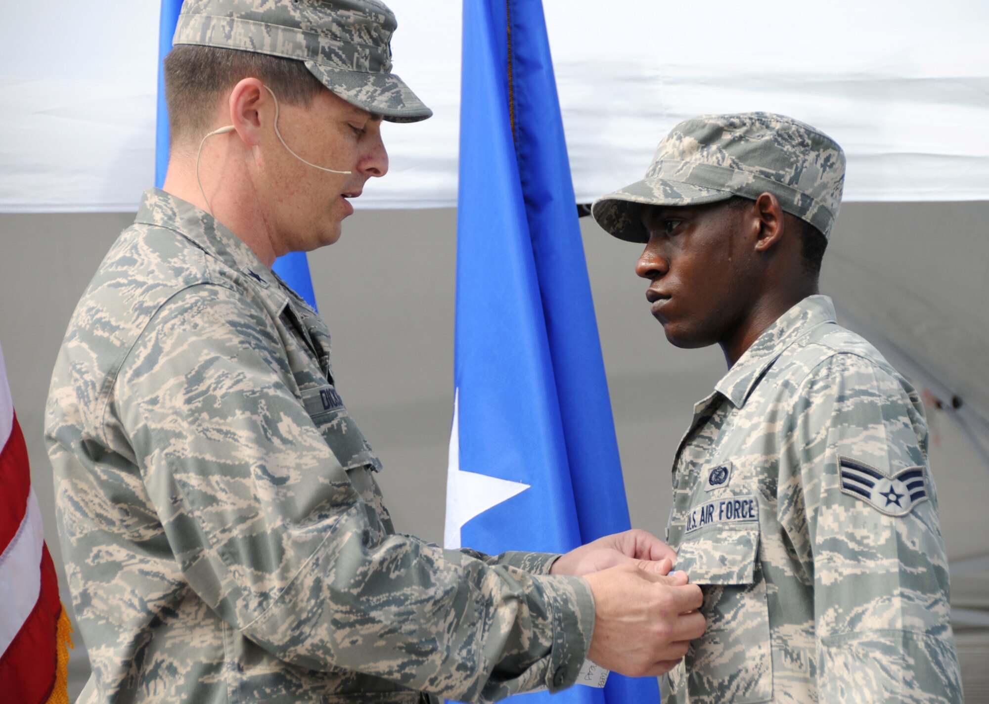 General Dickinson used the commander’s call before the birthday festivities began to present Senior Airman Eric Summers with the Air Force Achievement Medal.  Airman Summers, a member of the Keesler Public Affairs staff, was recognized for making it possible for Lucimarian Roberts, widow of the late Col. Lawrence Roberts, to view the ceremony dedicating the 403rd Wing’s consolidated aircraft maintenance building in her husband’s honor through the Defense Department’s Defense Connect Online service.  (U.S. Air Force photo by Kemberly Groue)
