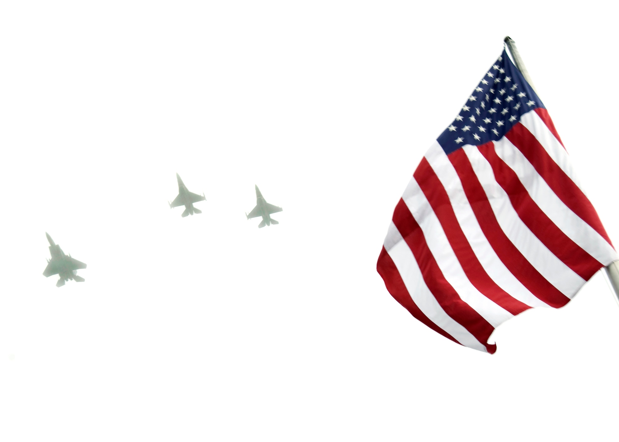 F-15s and F-16s from the 85th Test and Evaluation Squadron fly a missing man formation during the Prisoners-of-War/Missing-in-Action ceremony Sept. 18 at the Air Armament Museum.  The ceremony had guest speakers, honor guard, a choir and the Patriot Guard.  (U.S. Air Force photo/Mike Fleck.)