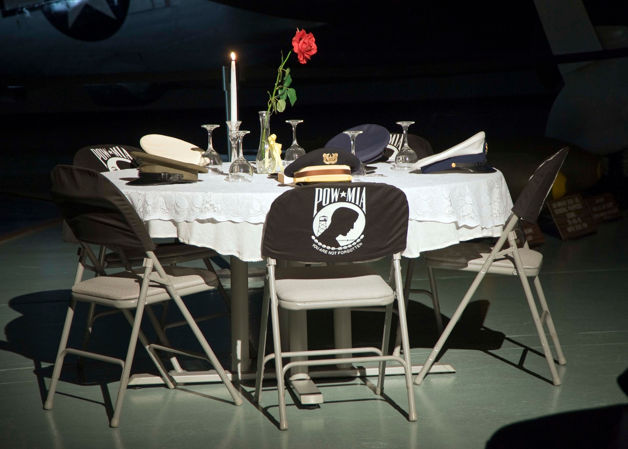 The Missing Man Table is spotlighted during the POW/MIA ceremony Sept. 18 at the Air Armament Museum.  The five table settings represent the five branches of the armed forces.  (U.S. Air Force photo/Mike Fleck.)