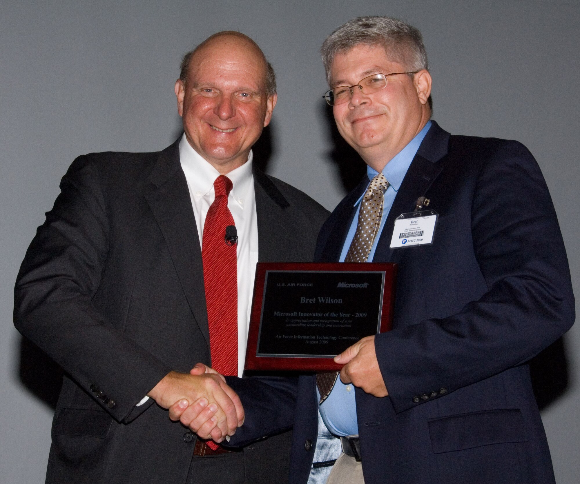 Microsoft chief executive officer Steve Ballmer presents Bret Wilson with the Microsoft Innovator of the Year Award during the Air Force Information Technology Conference 2009. The conference was held at the Renaissance Montgomery (Ala.) Hotel Aug. 24-27, 2009. (U.S. Air Force  photo/Melanie Rodgers Cox)