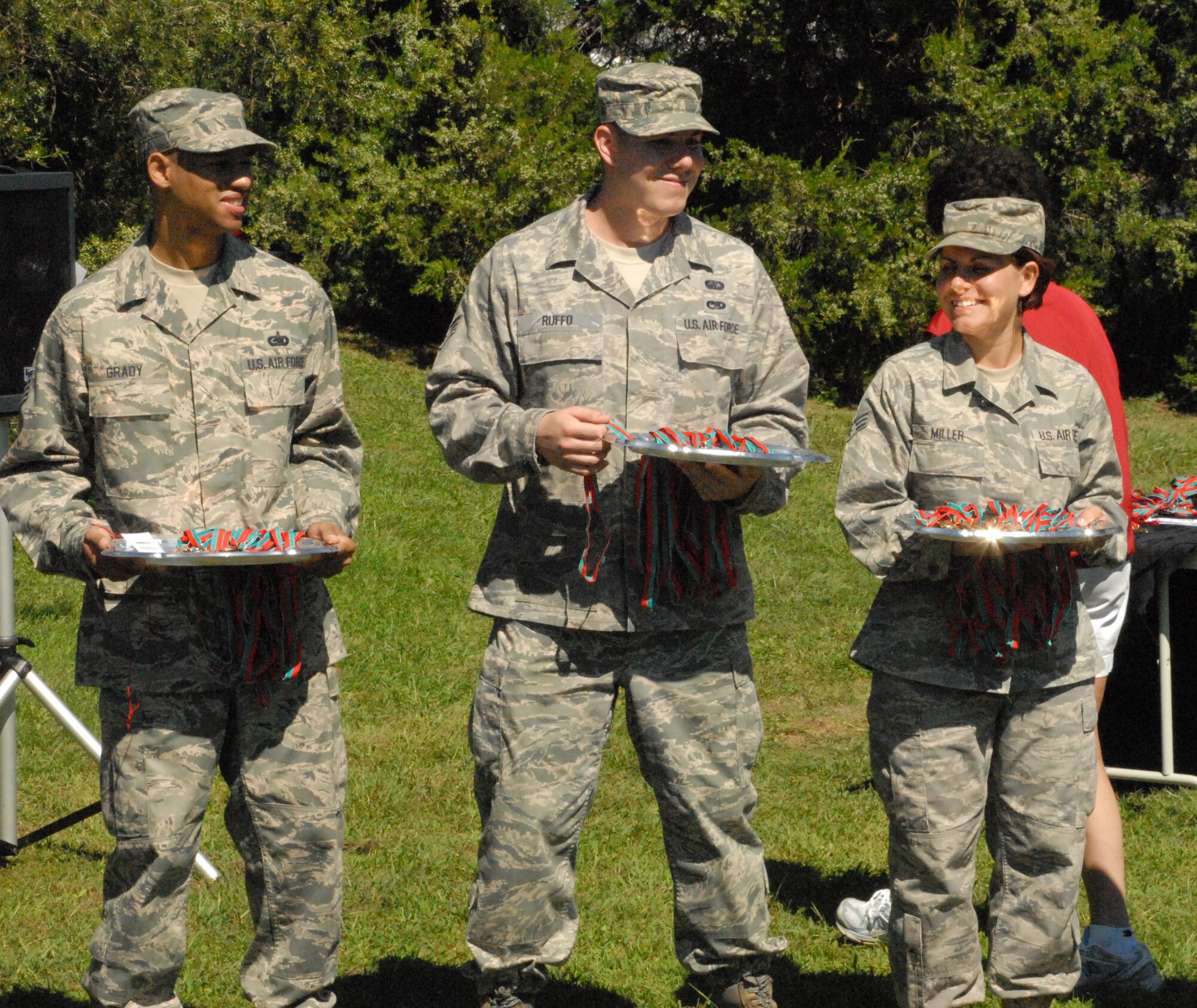 Dover Air Force Base volunteers help hand out the bronze, silver and gold medals after the Special Olympics bicycle races Sept. 19.  (U.S. Air Force photo/Staff Sgt. Chad Padgett)