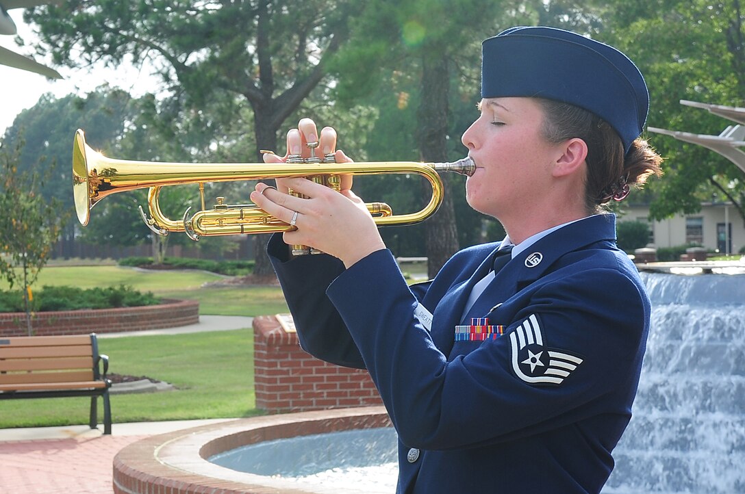 SEYMOUR JOHNSON AIR FORCE BASE, N.C. – Staff Sgt. Krystina Sweatt, 4th Aircraft Maintenance Squadron dedicated crew chief, plays “Taps” during the Missing in Action remembrance ceremony Sept. 18. “Taps” is a traditional military hymn signaling lights out, the closing of a funeral with honors or the conclusion of a POW/MIA ceremony. (U.S. Air Force photo/Airman 1st Class Rae Perry)