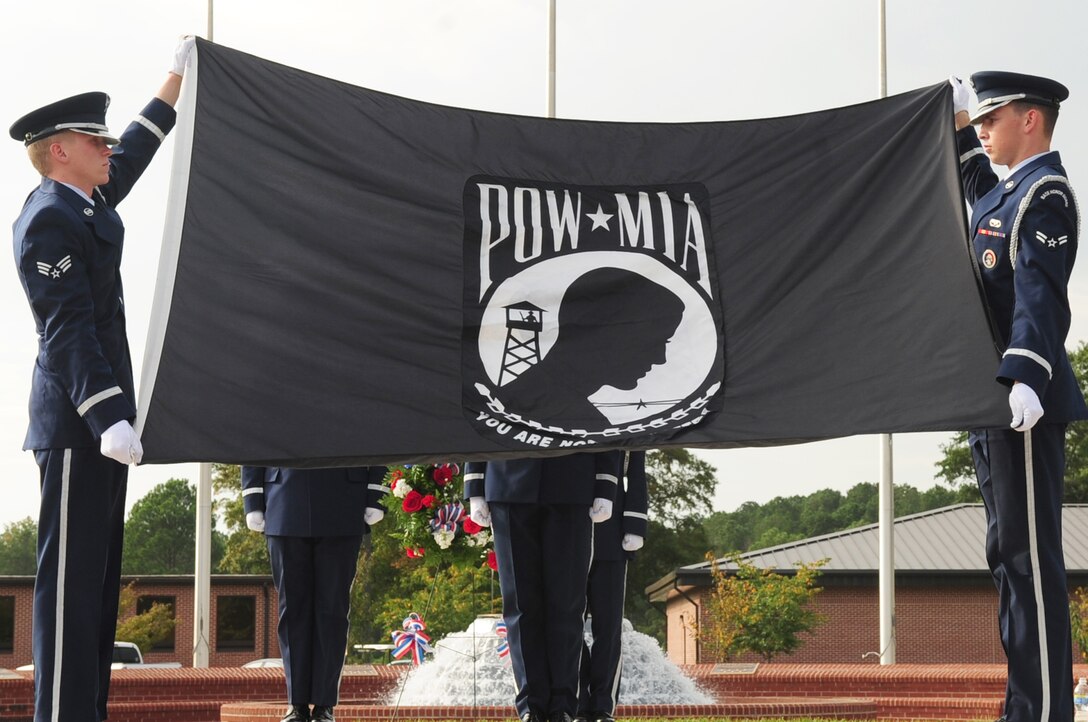 SEYMOUR JOHNSON AIR FORCE BASE, N.C. – Members of the 4th Fighter Wing Honor Guard fold the Prisoner of War - Missing in Action flag during a remembrance ceremony Sept. 18. Many POWs from the local area attended to pay their respects and were honored for their sacrifices. (U.S. Air Force photo/Airman 1st Class Rae Perry)