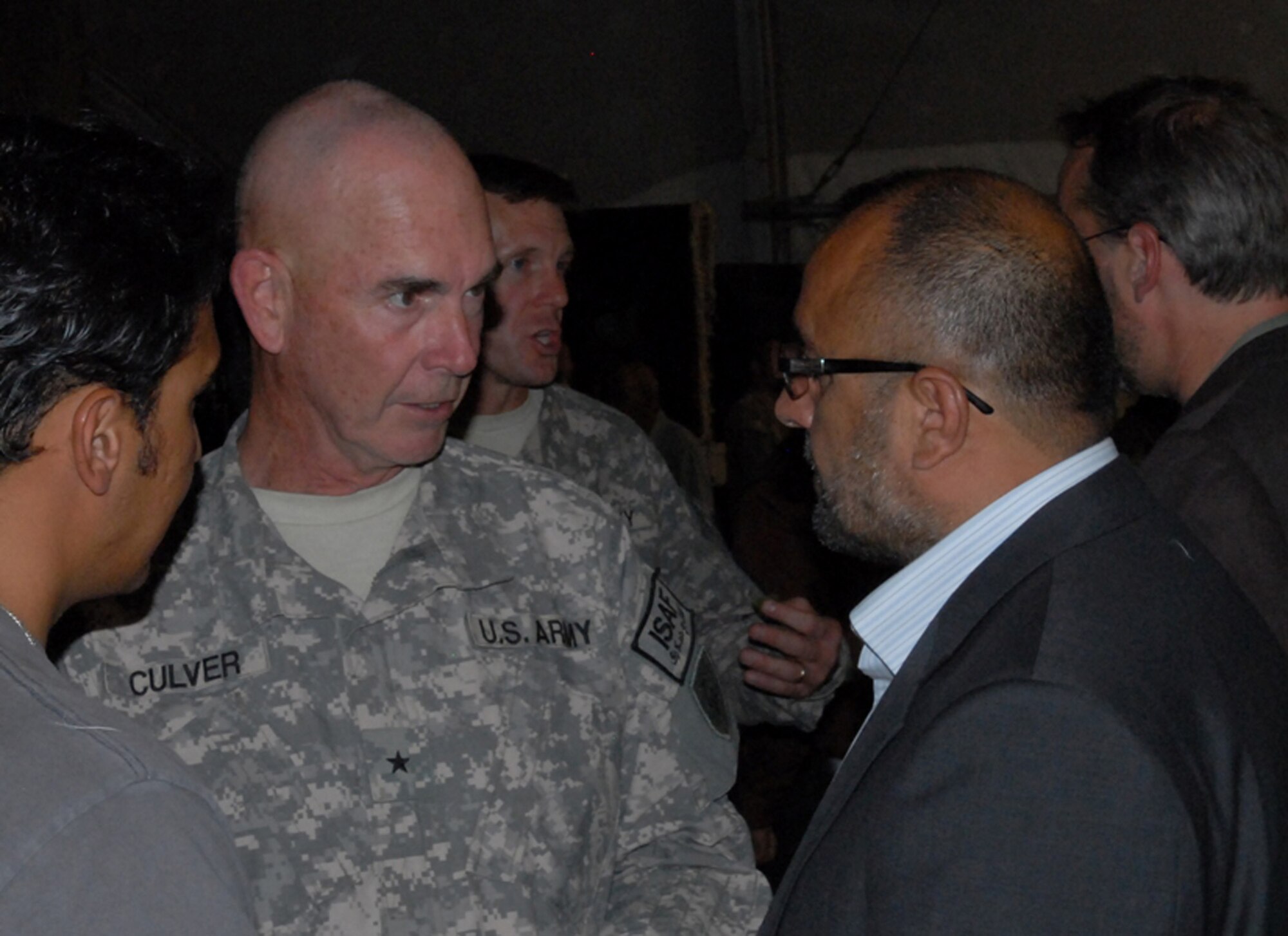 BAGRAM AIRFIELD, Afghanistan -- Task Force Cyclone commander, Brig. Gen. Lonnie Culver, commanding general, 38th Infantry Division, speaks with Panjshir provincial Governor Haji Bahlol during an Eid ul-Fitr celebration held at Bagram Air Field, Afghanistan, Sept. 21. Many dignitaries, coalition leaders and professionals met to celebrate the Muslim holiday ending the fasting of Ramadan. (U.S. Army photo/Spc. William E. Henry) 