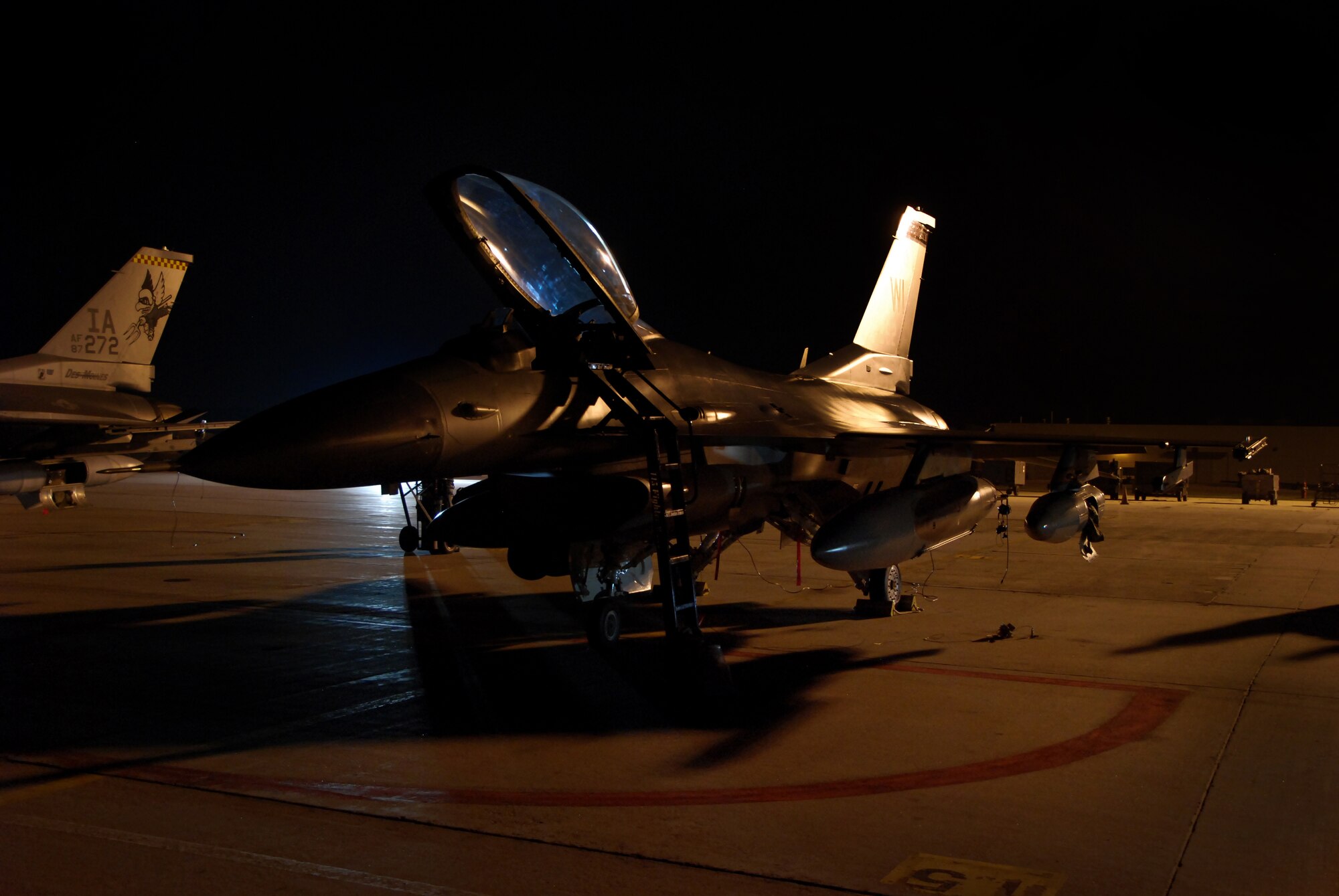 An F-16 Fighting Falcon from the 115th Fighter Wing, Madison, WI, sits prepped for its flight to Iraq, Sept. 22.  The 115th launched 14 F-16s early Tuesday morning as a part of the Wing's scheduled Air Expeditionary Force rotation that began last week when approximately 200 Airmen deployed to theater.  (U.S. Air Force photo by Staff Sgt. Ashley Bell)