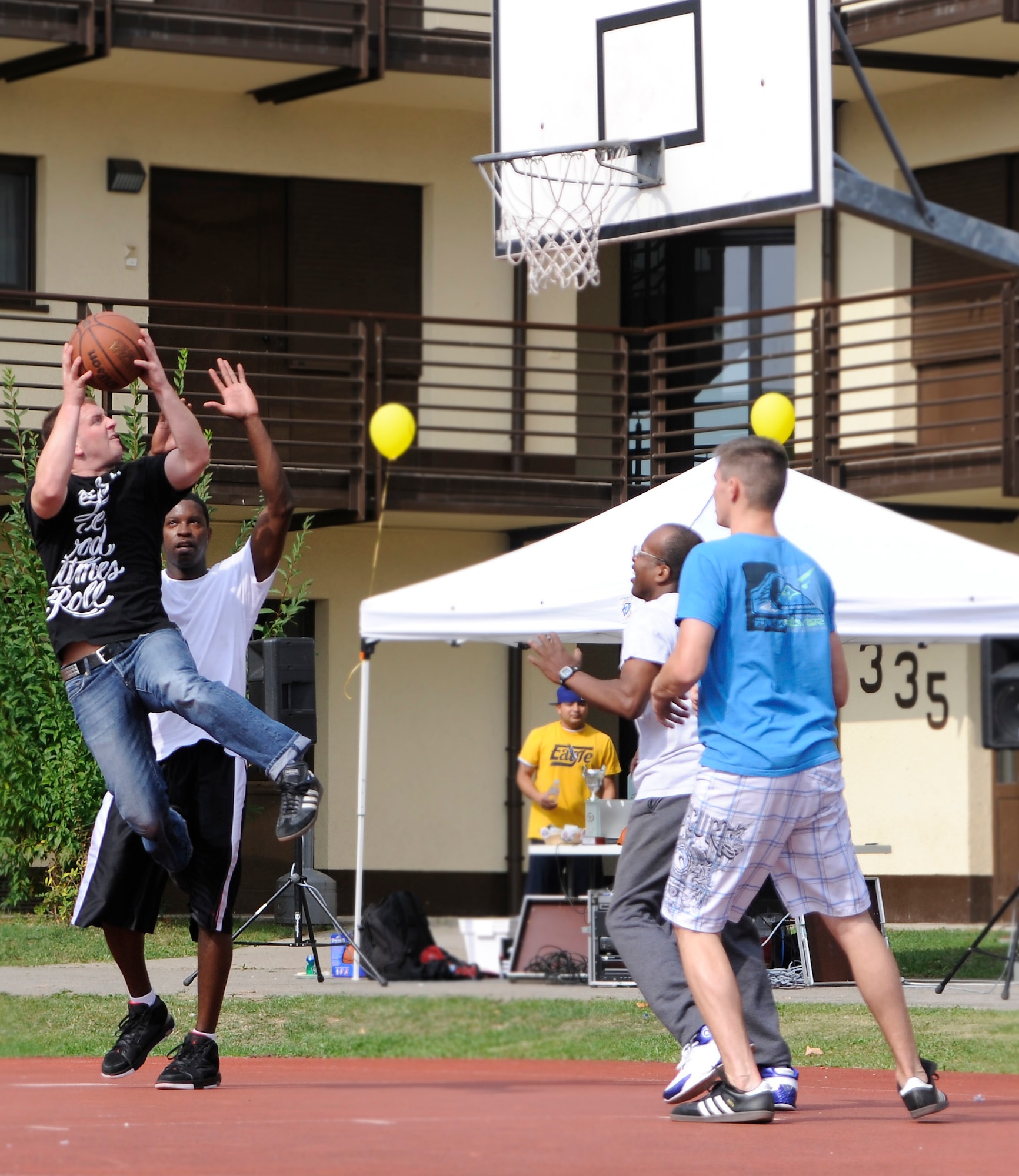 SPANGDAHLEM AIR BASE Germany – Senior Airman Tyler Austin, 52nd Civil Engineering Squadron, goes up for a two-point shot for his squadron in a game of three-on-three basketball against the 726th Air Mobility Squadron first sergeant’s team during the annual Airman’s Block Party Sept. 19.  Airmen enjoyed various games and a burger cookout sponsored by the 52nd Fighter Wing First Sergeants and Spangdahlem First IV. The 52nd Security Forces Squadron won the most events and took home the “Battle of the Dorms” trophy. (U.S. Air Force photo/Master Sgt. Bill Gomez)