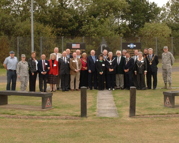 Brisish Civic Leaders gather at the 303rd Bomb Wing Memorial for a photo during a visit to RAF Molesworth.