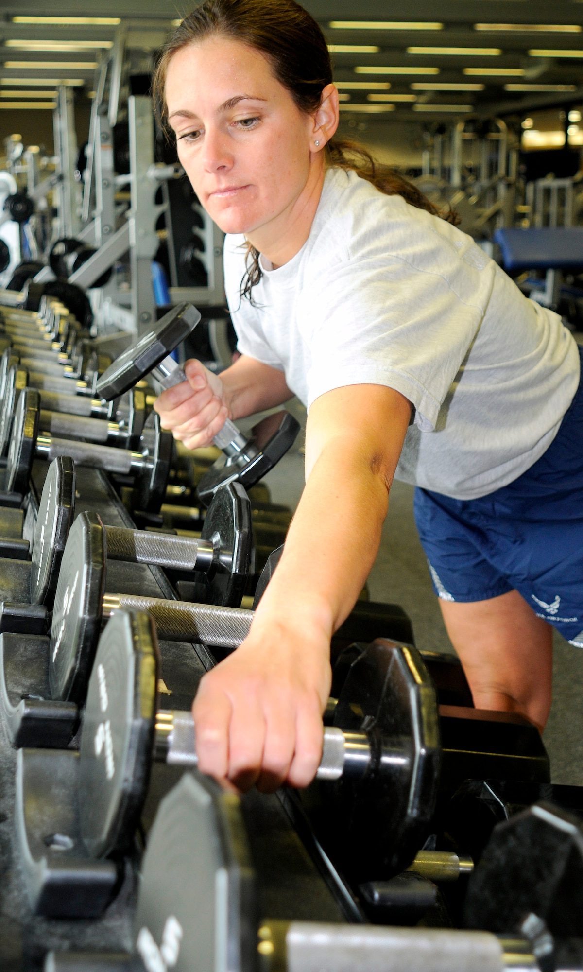 U.S. Air Force Lt. Col. Jennifer Kilbourn,  HQUSAFE  A4/7, Chief, Readiness Division, (USAFE A7X) lifts weights to stay Fit to Fight, Ramstein, Germany, Sept. 14, 2009.  (U.S. Air Force photo by Tech. Sgt. Kenneth Bellard)