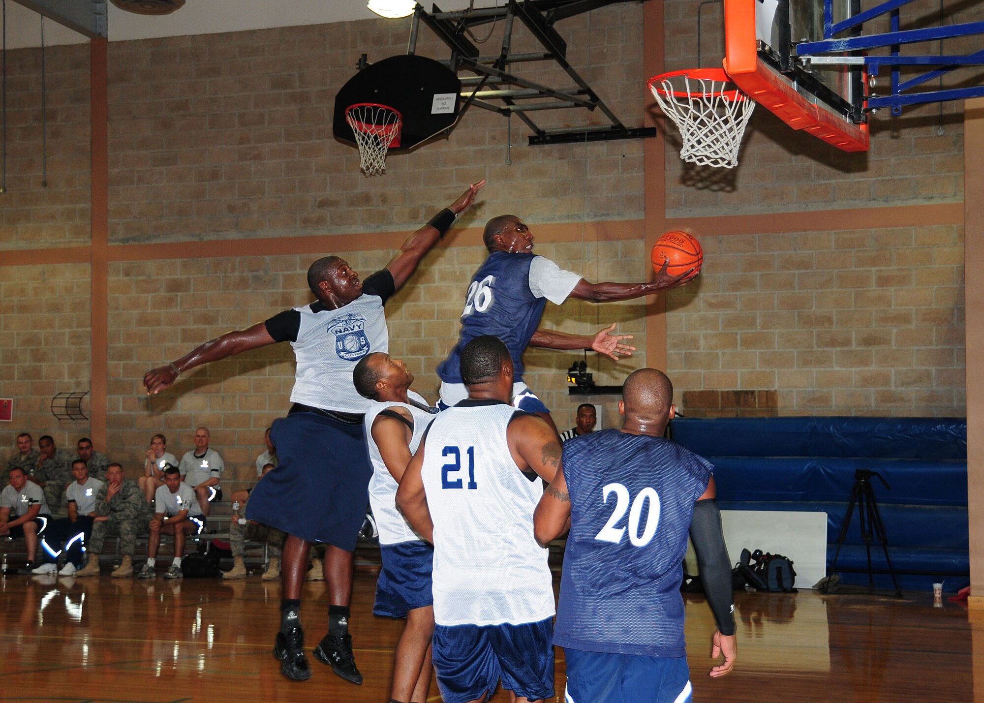 SOUTHWEST ASIA -- Capt. Marcus Pendleton, 737th Expeditionary Airlift Squadron Air Force member, drives to the hoop during the Coalition Games all-star basketball game competition against the Navy at an undisclosed location in Southwest Asia Sept. 20, 2009.  The Air Force won the game 61-57.  (U.S. Air Force photo/Tech. Sgt. Tony Tolley)