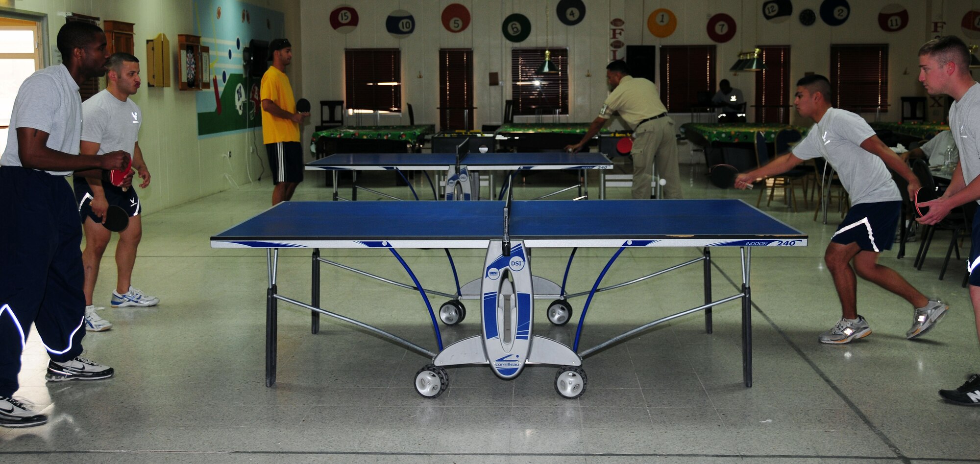 SOUTHWEST ASIA -- 386th Air Expeditionary Wing members compete in the Coalition Games ping pong competition at an undisclosed location in Southwest Asia Sept. 19, 2009.  (U.S. Air Force photo/Tech. Sgt. Tony Tolley)