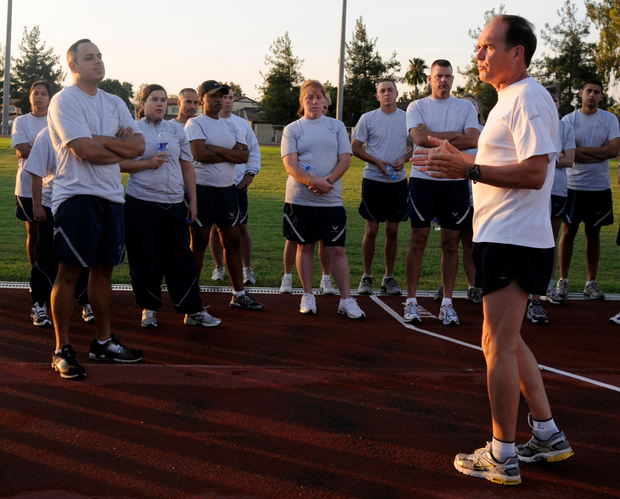 Craig Virgin, an American Olympian, speaks to Incirlik members about running intervals Wednesday, Sept. 17, 2009, during a physical training session at Incirlik Air Base, Turkey. Mr. Virgin, along with Karen Fox came to Incirlik for morale support and to help start off Incirlik’s half-marathon. (U.S. Air Force photo by/Airman 1st Class Amber Ashcraft)