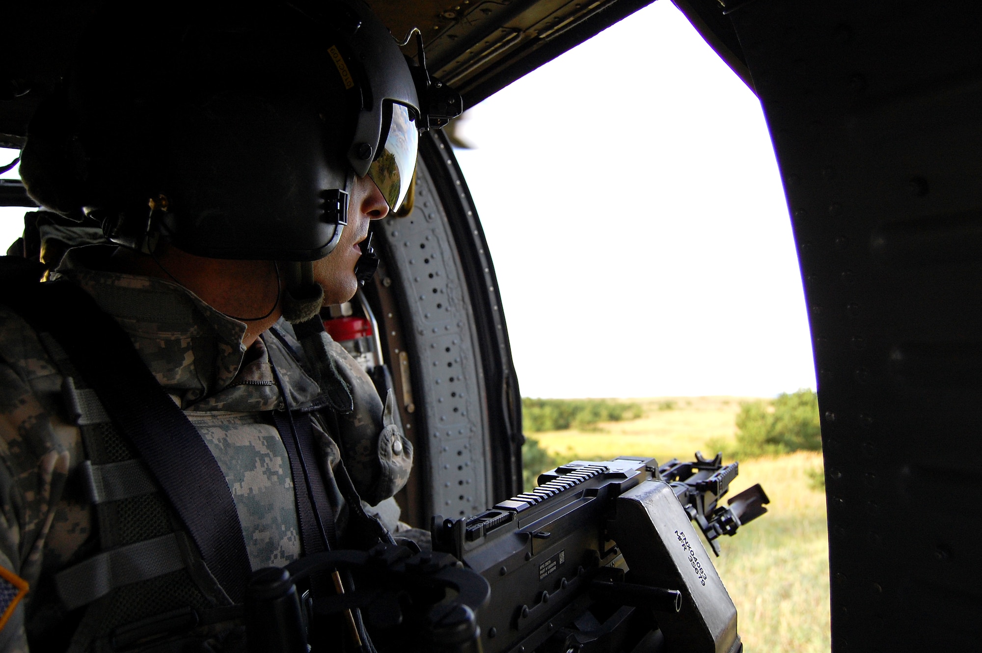 Spc. Blake Kelley, 78th Aviation Battalion crew chief, prepares to fire at targets at Draughon Range September 17th. The 78th Aviation Battalion is stationed out of Camp Zama, Japan. (U.S. Air Force photo/Staff Sgt. Fernando X. Burgos-Ortiz)