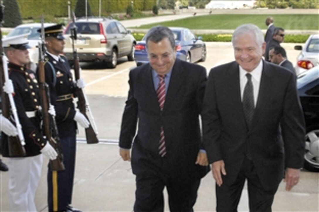 Defense Secretary Robert M. Gates, right, escorts Israeli Defense Minister Ehud Barak through a cordon of honor guards upon his arrival at the Pentagon to discuss bilateral defense issues, Sept. 21, 2009. 