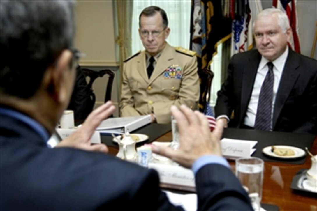 Defense Secretary Robert M. Gates, right, and Navy Adm. Mike Mullen, chairman of the Joint Chiefs of Staff, center, talk with Israeli Defense Minister Ehud Barak about bilateral defense issues at the Pentagon, Sept. 21, 2009. 