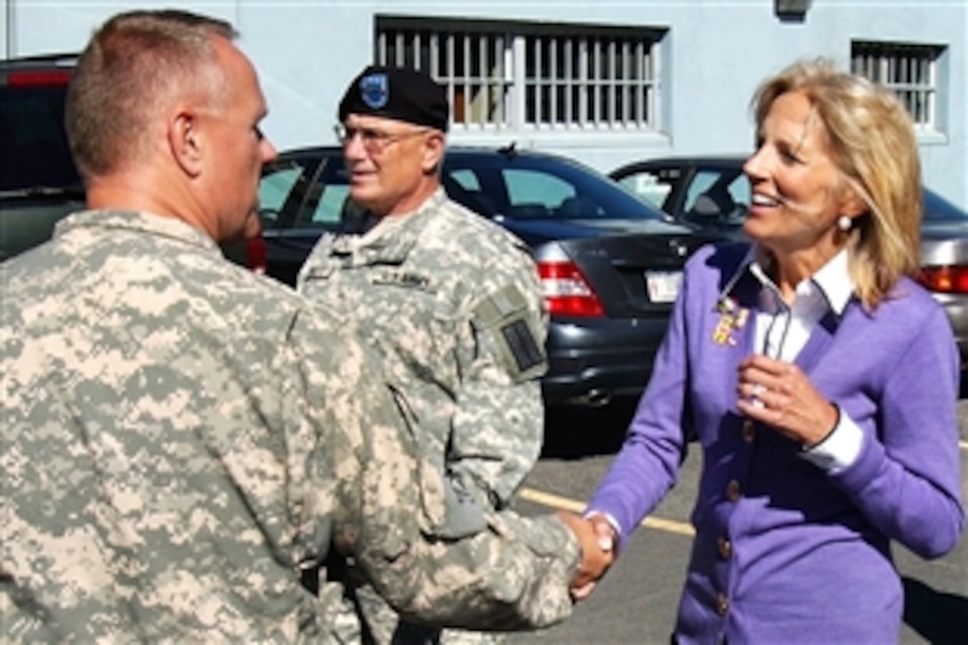 Jill Biden greets U.S. Army Col. Michael Bobeck, commander of the 42nd Combat Aviation Brigade, during a visit to New York National Guard Headquarters in Latham, Sept. 21, 2009, to discuss family support issues. Maj. Gen. Joseph Taluto, the adjutant general, accompanied her during her visit.