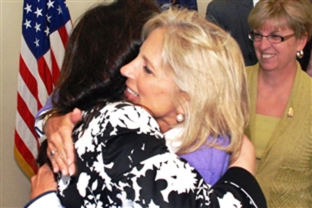 Jill Biden, right, hugs Theresa Martel, whose husband, Army 1st Sgt. Joseph Martel, is deployed with the 206th Military Police Company in Basra, Iraq, at the New York Army National Guard headquarters in Latham, Sept. 21, 2009. Susan Taluto, the wife of Maj. Gen. Joseph Taluto, the adjutant general, looks on.U.S. 