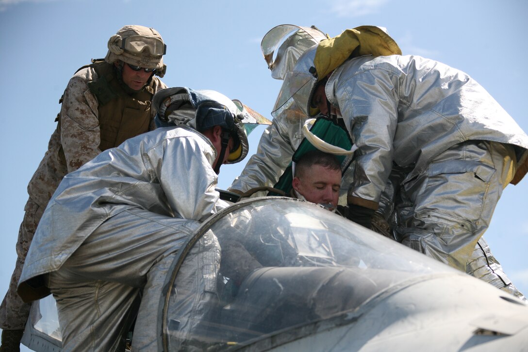 Marine Wing Support Squadron 274 aircraft rescue firefighters perform a platform rescue on Sgt. Maj. William J. Grigsby, MWSS-274’s senior enlisted advisor, during a training exercise at Marine Corps Auxiliary Landing Field Bogue, Sept. 23. The training was conducted Sept. 14 through 25 and tested all of the squadron’s capabilities.