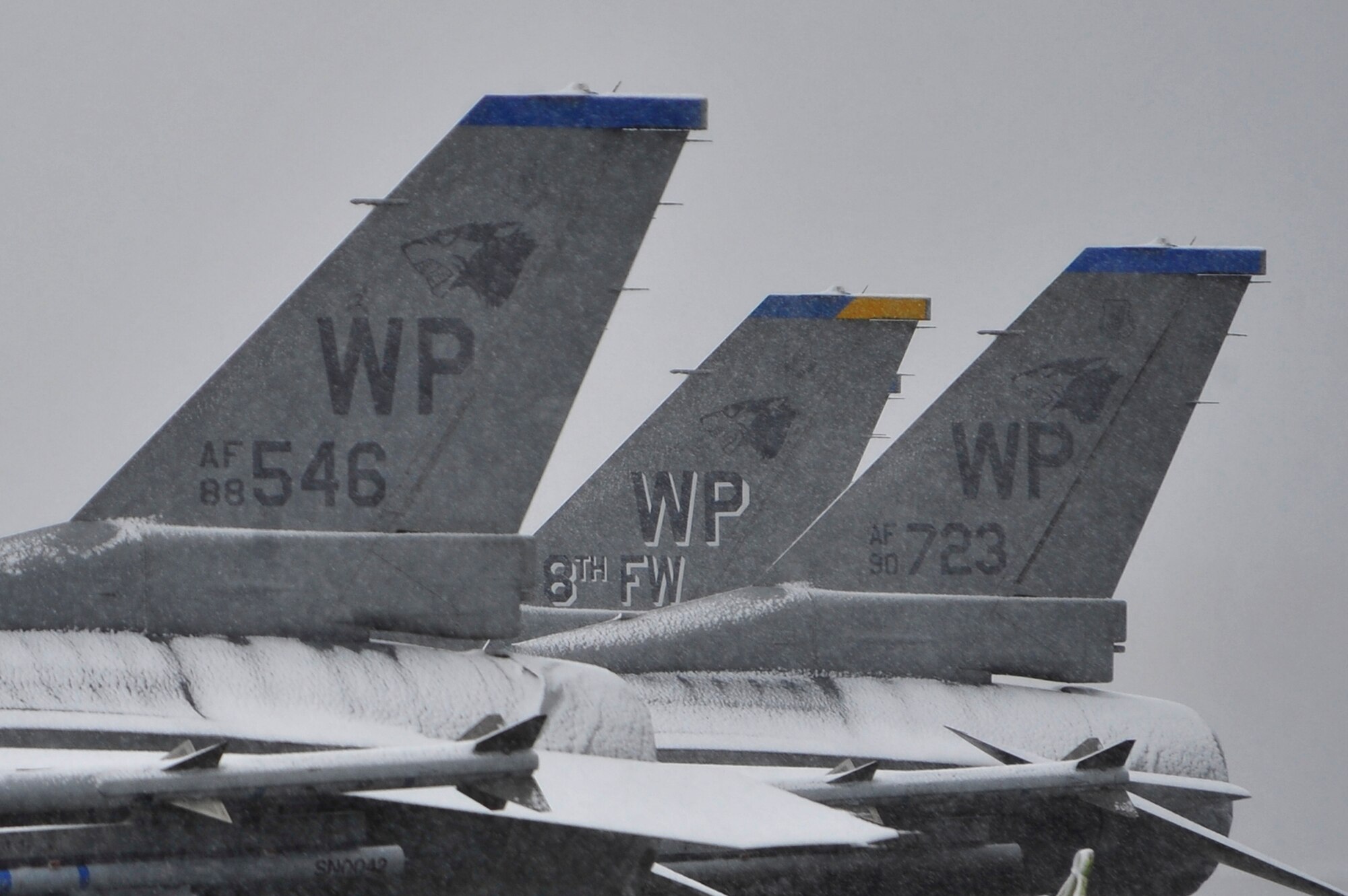 Eielson's first snow fall collects on a row of F-16 Fighting Falcons deployed here from Kunsan Air Base, Republic of Korea, Sept. 23, 2009, Eielson AFB, Alaska. The F-16's are deployed to Eielson for RED FLAG-Alaska, which runs from Oct. 1 to 16. (U.S. Air Force photo/Staff Sgt. Christopher
Boitz)
