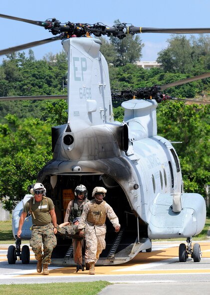 A litter team off-loads patients from a Marine CH-46 Sea Knight helicopter to be triaged at Lester Hospital Sept. 17 as part of Ryukyu Warrior II, a mass casualty evacuation exercise conducted by Marine Aircraft Group 12, with the participation of Air Force, Army, and Navy organizations.  
(U.S. Air Force photo/Tech. Sgt. Reynaldo Ramon) 



