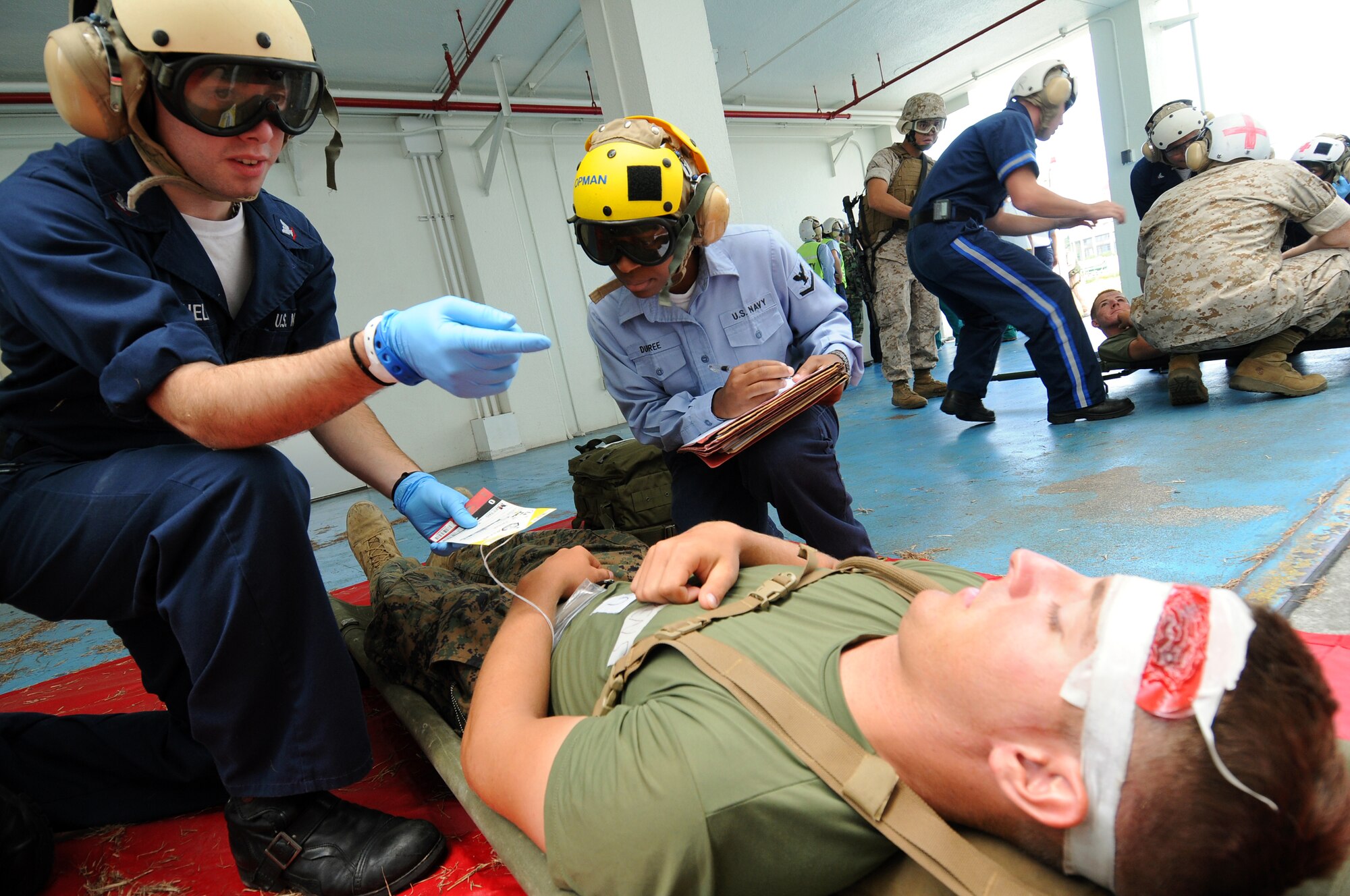 The area relief disaster team from Lester Hospital triages casualties before turning them over to the 18th Aeromedical Evacuation Squadron during Ryukyu Warrior II Sept. 17. Ryukyu Warrior II was a mass casualty evacuation exercise conducted by Marine Aircraft Group 12, with the participation of Air Force, Army, and Navy organizations.  (U.S. Air Force photo/Tech. Sgt. Reynaldo Ramon) 



