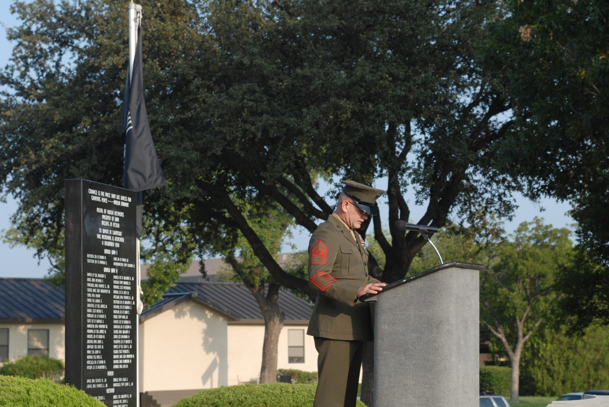 GOODFELLOW AIR FORCE BASE, Texas -- Marine Master Gunnery Sgt. Peter Bordeleau, Marine Corps Detachment, reads the name of a Marine still missing in action during the Prisoner of War/Missing in Action ceremony, Sept. 18, 2009. Base personnel stood a 24-hour vigil honoring POWs and MIAs. (U.S. Air Force photo/Staff Sgt. Laura R. McFarlane)