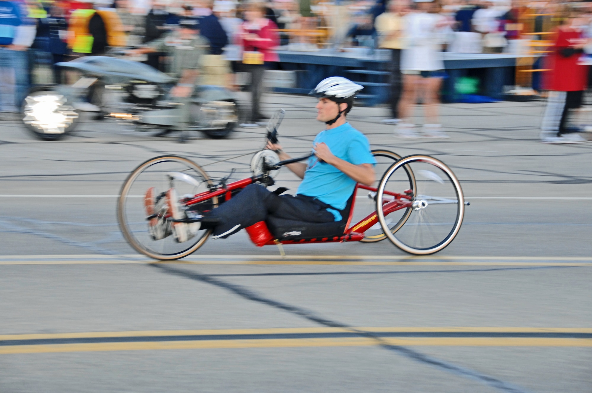 John Moore of Centerville, Ohio, pilots a hand cycle during the U.S. Air Force Marathon Sept. 19, 2009 at Wright-Patterson Air Force Base, Ohio. Moore was paralyzed from the waist down in Septermber 2008 during an accident following the passage of Hurricane Ike. He is a firefighter with the city of Kettering, Ohio. He finished the 26.2 miles averaging just over 5 minutes per mile.  His wife Meredyth ran the half marathon. (Air Force photo/Ben Strasser)