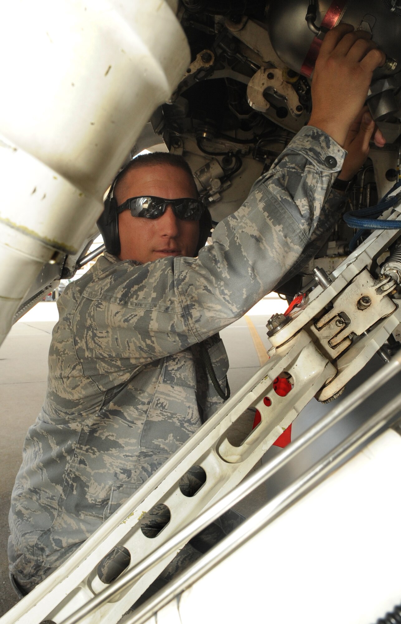 SHAW AIR FORCE BASE, S.C. -- Lieutenant Col. Andy Shanahan, 20th Aircraft Maintenance Squadron commander, poses for a photo under anF-16 Sept. 8. "My top goal is to be the top AMXS in the Air Force, and successfully deploy and return three aircraft maintenance units over three air expeditionary force rotations," he said. (U.S. Air Force Photo/Senior Airman David Minor)