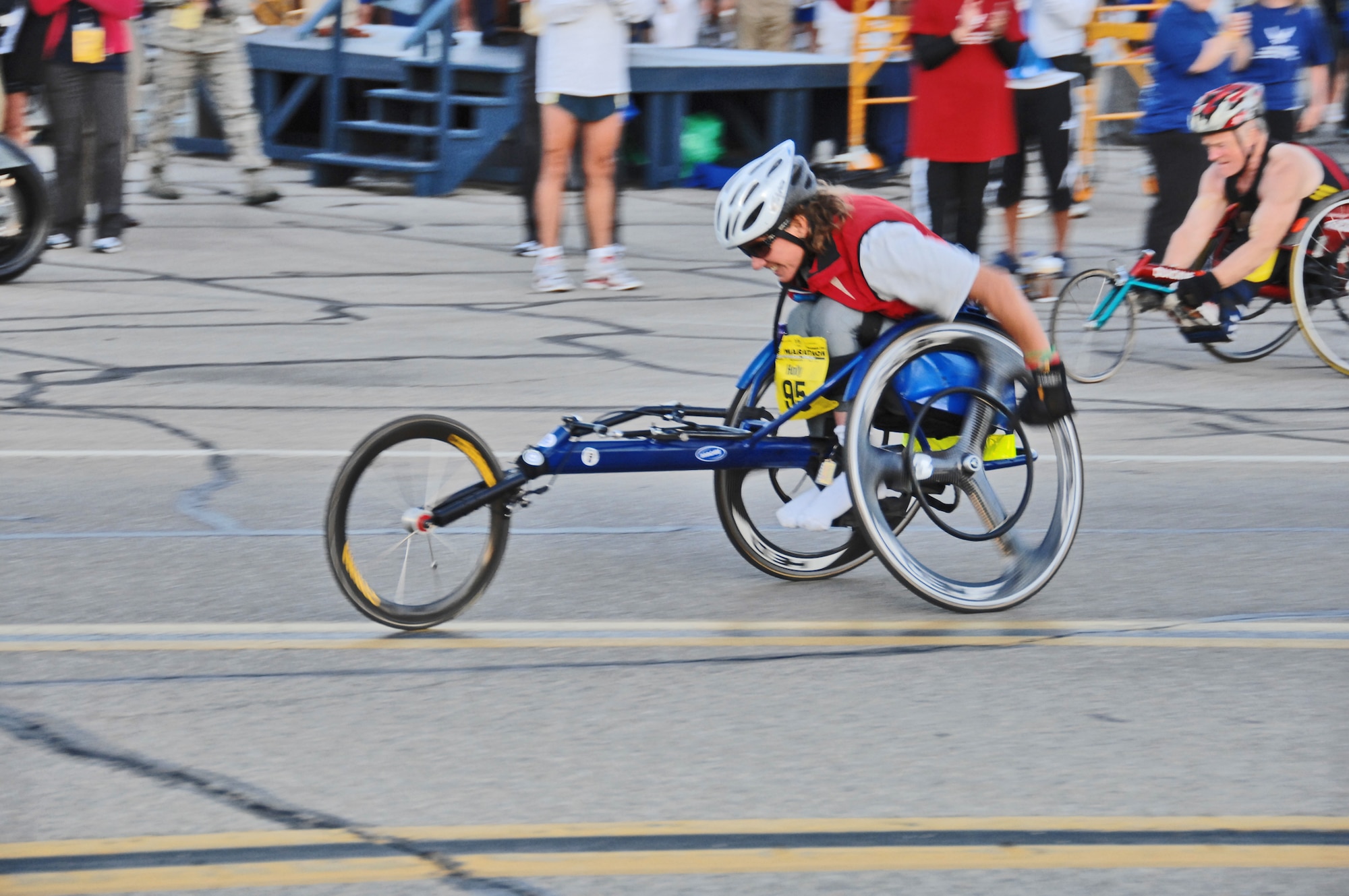 Wheel racer Holly Koester of Cleveland accelerates to her pace during the 13th Annual U.S. Air Force Marathon Sept. 19, 2009 at Wright-Patterson Air Force Base, Ohio.  Ms. Koester, who was paralyzed below the waist from a 1990 accident, has participated in all but one of the Air Force Marathons held to date.  (Air Force photo/Ben Strasser)