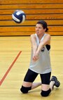 Kaitlyn Lynch returns a serve during the 1st Combat Camera Squadron and 373rd Training Squadron, Detachment 5 volleyball game at the Fitness and Sports Center here Sept. 22. The 1 CTCS defeated the 373 TRS 2-0. Lynch is a videographer with the 1 CTCS. (U.S. Air Force photo/James Bowman)