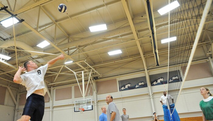 Kelby Hagerla prepares to spike a volleyball during the 437th Operations Group Flyers and 437th Maintenance Squadron volleyball game at the Fitness and Sports Center here Sept. 22. The volleyball season kicked off on Aug. 25 and will end Oct. 13. Hagerla is a pilot with the 16th Airlift Squadron. (U.S. Air Force photo/James Bowman)