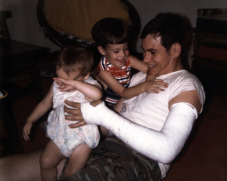 HANSCOM AIR FORCE BASE, Mass. - Capt. Pete Cleary plays with his 2-year-old daughter and 4-year-old son while stationed at Clark Air Base, Philippines. Nearly 30 years later, the U.S. Air Force found the remains of the captain and his aircraft that crashed Oct. 10, 1972, and notified his son. Captain Cleary’s cast is a result of a motor-scooter accident he suffered during his family’s two years in the Philippines. (Courtesy photo)