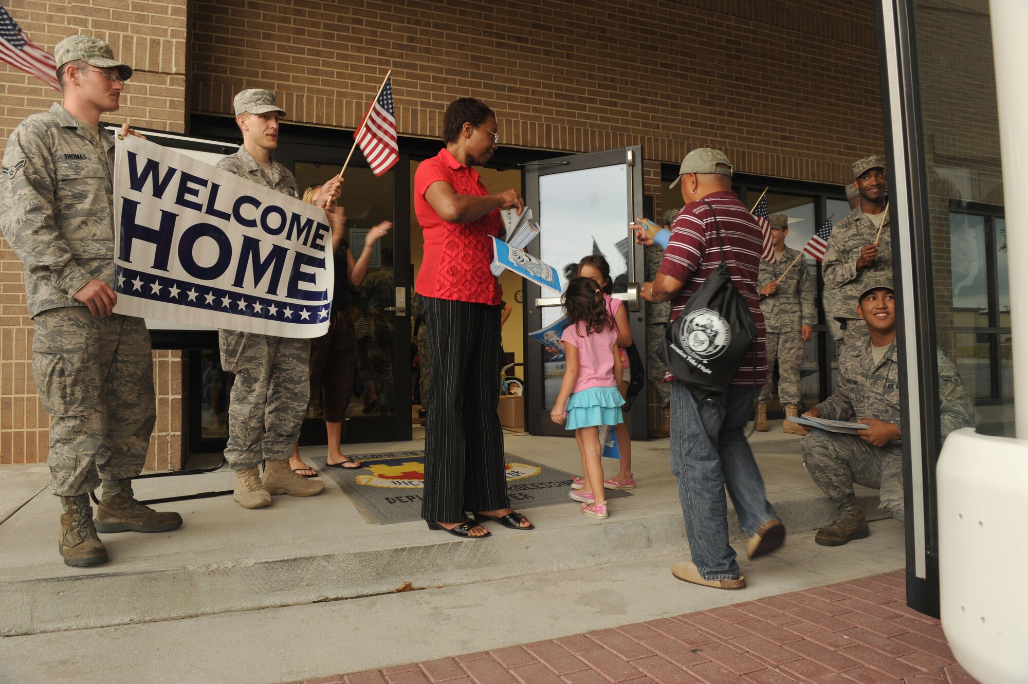 SHAW AIR FORCE BASE, S.C. -- Team Shaw welcomes home Operation Take-Flight participants as they return from their simulated deployment to the fictional country Shawkikistan Sept. 17. Children ages 4 to12 got to experience what their mom and dad go through when deploying, which gives them a better understanding of the deployment process and helps relieve anxiety. (U.S. Air Force Photo/Senior Airman David Minor)