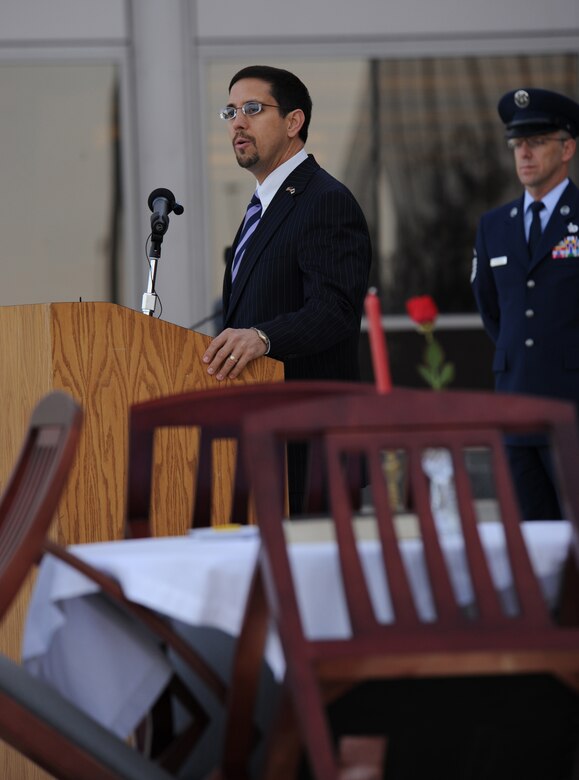 SCHRIEVER AIR FORCE BASE, Colo. - Robert Apodaca delivers the keynote address at Schriever's POW/MIA Remembrance Ceremony Sept. 18. Mr. Apodaca's father, Maj. Victor Apodaca, was listed MIA for nearly 35 years after his F-4C fighter jet was shot down over North Vietnam June 8, 1967. Mr. Apodaca's father's remains were finally returned home Sept. 2001. (U.S. Air Force photo/Amber Whittington)