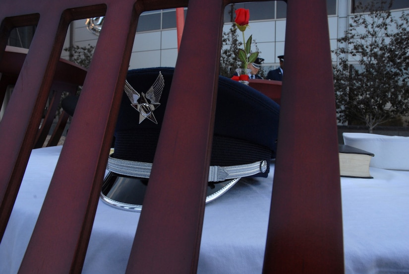 SCHRIEVER AIR FORCE BASE, Colo. - The POW/MIA table is a way of symbolizing those servicemembers who are unable to attend military ceremonies due to their sacrifice in defense of freedom. The table was part of the POW/MIA remembrance ceremony held in front of the DeKok Building Sept. 18. (U.S. Air Force photo/Staff Sgt. Stacy Foster) 