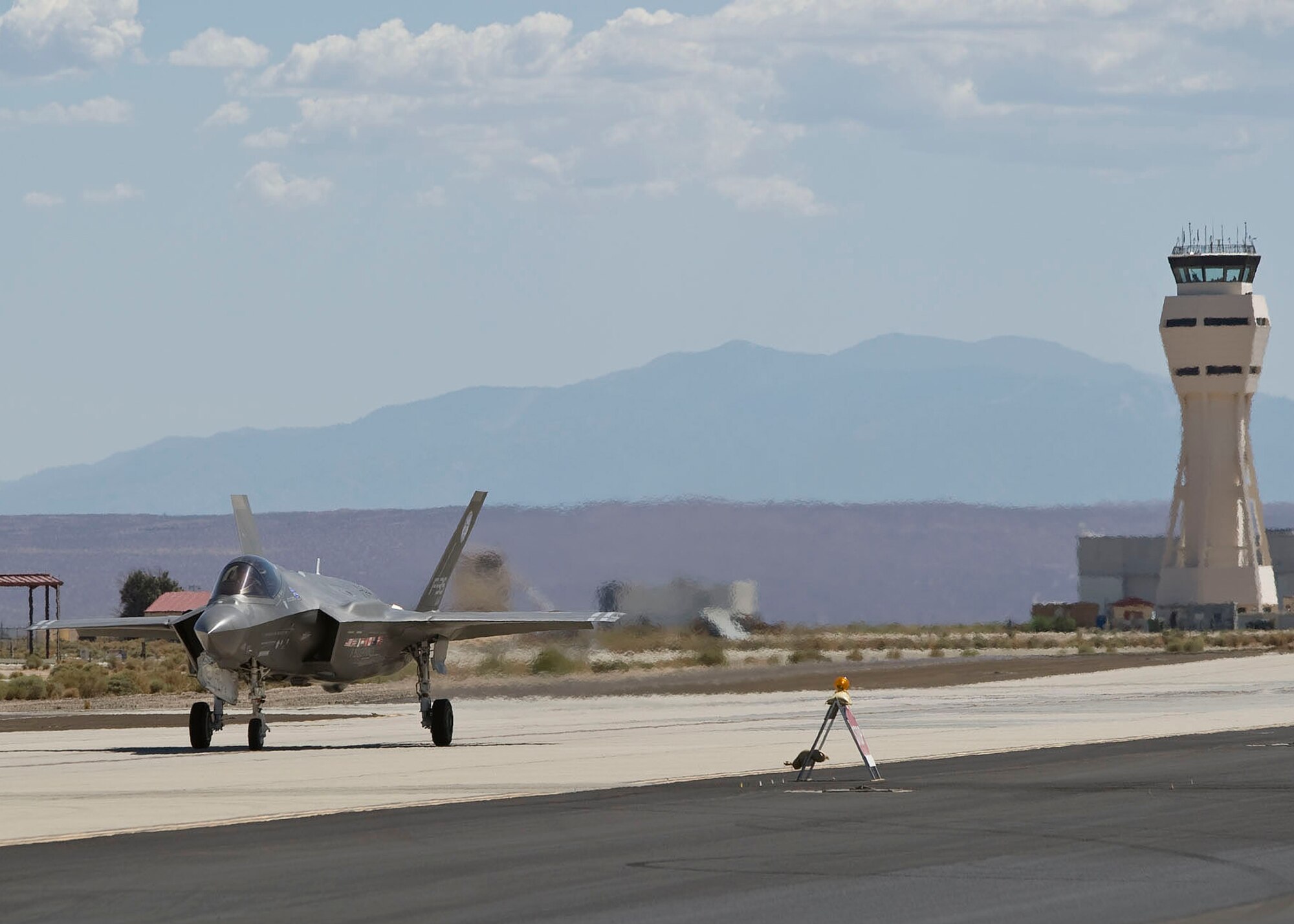 An F-35 Joint Strike Fighter, lands at Edwards Sept 10. The F-35 Joint Strike Fighter will perform barrier tests along with various other test points during its extended stay at Edwards. (Lockheed Martin photo/Kevin Robertson)