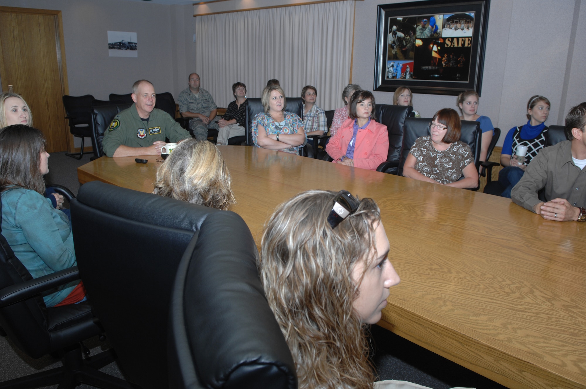 MINOT AIR FORCE BASE, N.D. -- Col. Joel Westa, 5th Bomb Wing commander, briefs 22 members of the Community Leadership Institute, comprised of new members every year chosen through the Minot Area Chamber of Commerce. The group toured the base Sept. 18. and was hosted by several squadrons to familiarize them to the various missions of the base. The tour included the 54th Helicopter Squadron and an up close and inside look of a B-52H Stratofortress, the platform operated by the 5th BW. (U.S. Air Force photo by Staff Sgt. Stacy Moless)