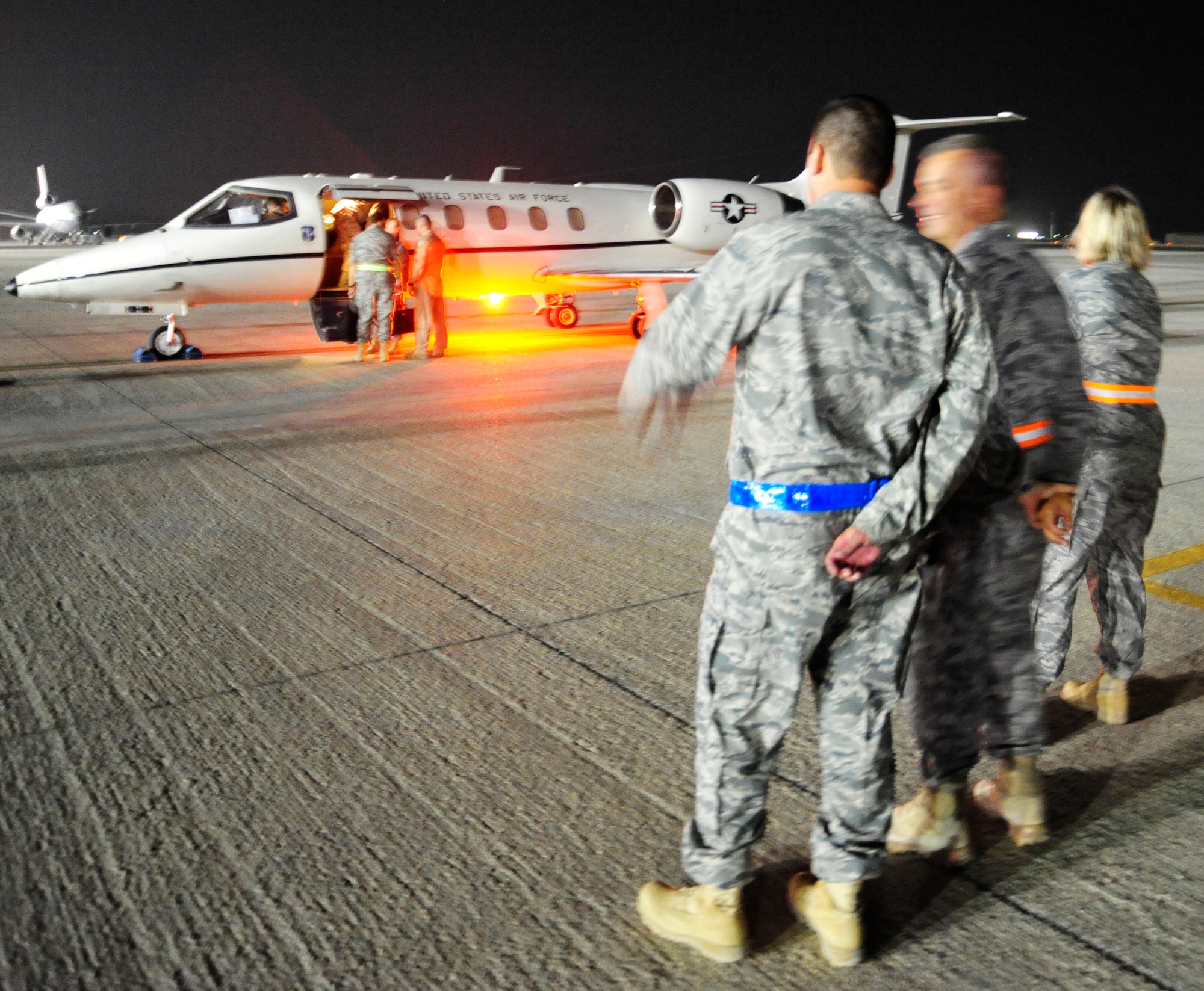 SOUTHWEST ASIA-A plane prepares for departure from the 380th Air
Expeditionary Wing in the evening of Sept. 21, 2009. Maj. Gen. (Select)
Timothy Byers, the Air Force Civil Engineer, boards the aircraft after
touring one of the 166 Air Force bases that he is responsible for worldwide.
(U.S. Air Force photo/Tech. Sgt. Charles Larkin Sr)
