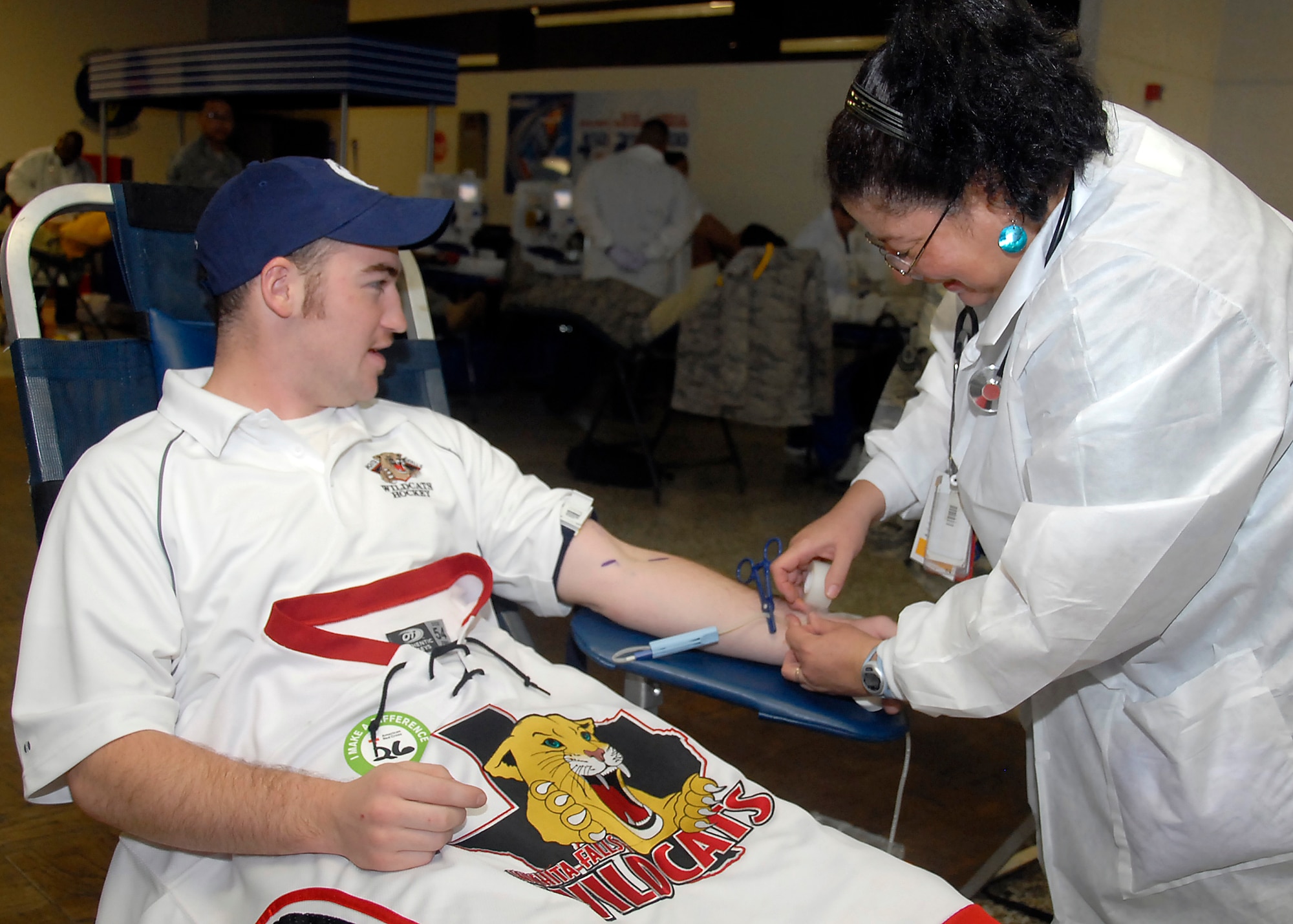 Sean McKenzie, a member of the Wichita Falls, TX Wildcats Hockey Team, donates blood at the American Red Cross Drive Sept. 22 at the Airman’s Club. This blood drive was geared to break a state blood donation record. (U.S. Air Force photo/ Mike Litteken)