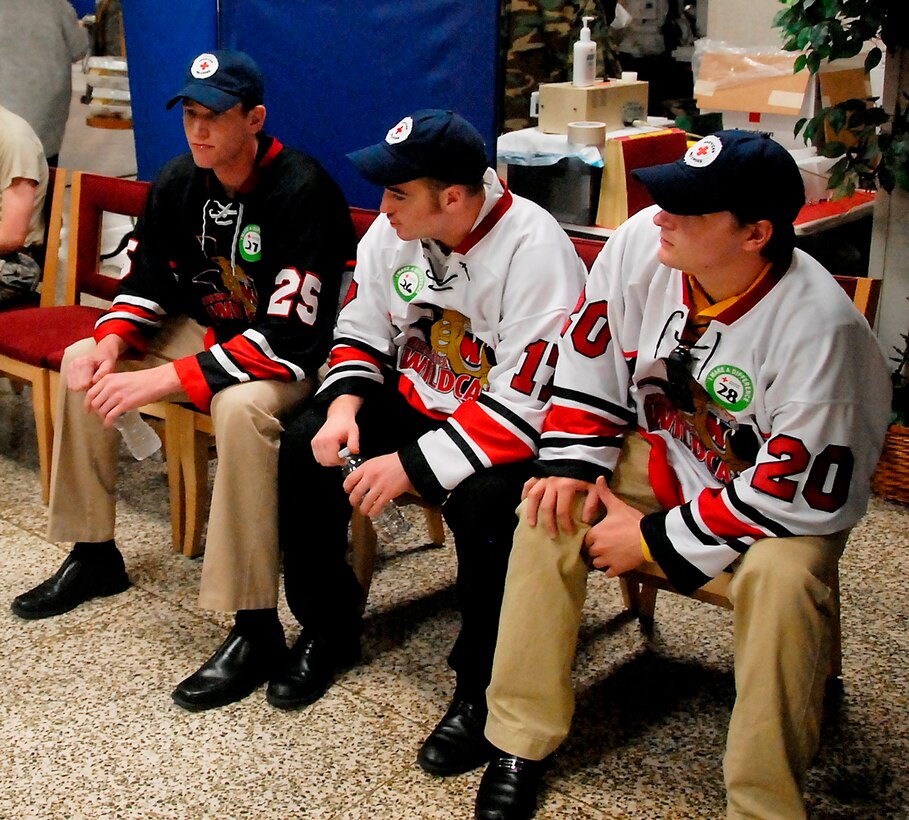Members of the Wichita Falls, TX Wildcats Hockey Team wait to give blood at the American Red Cross Drive Sept. 22 at the Airman’s Club. From left to right the members are #25 Chris Rial, #17 Sean McKenzie and #20 Brandon Stroud. This blood drive was geared to break a state blood donation record. (U.S. Air Force photo/ Mike Litteken)