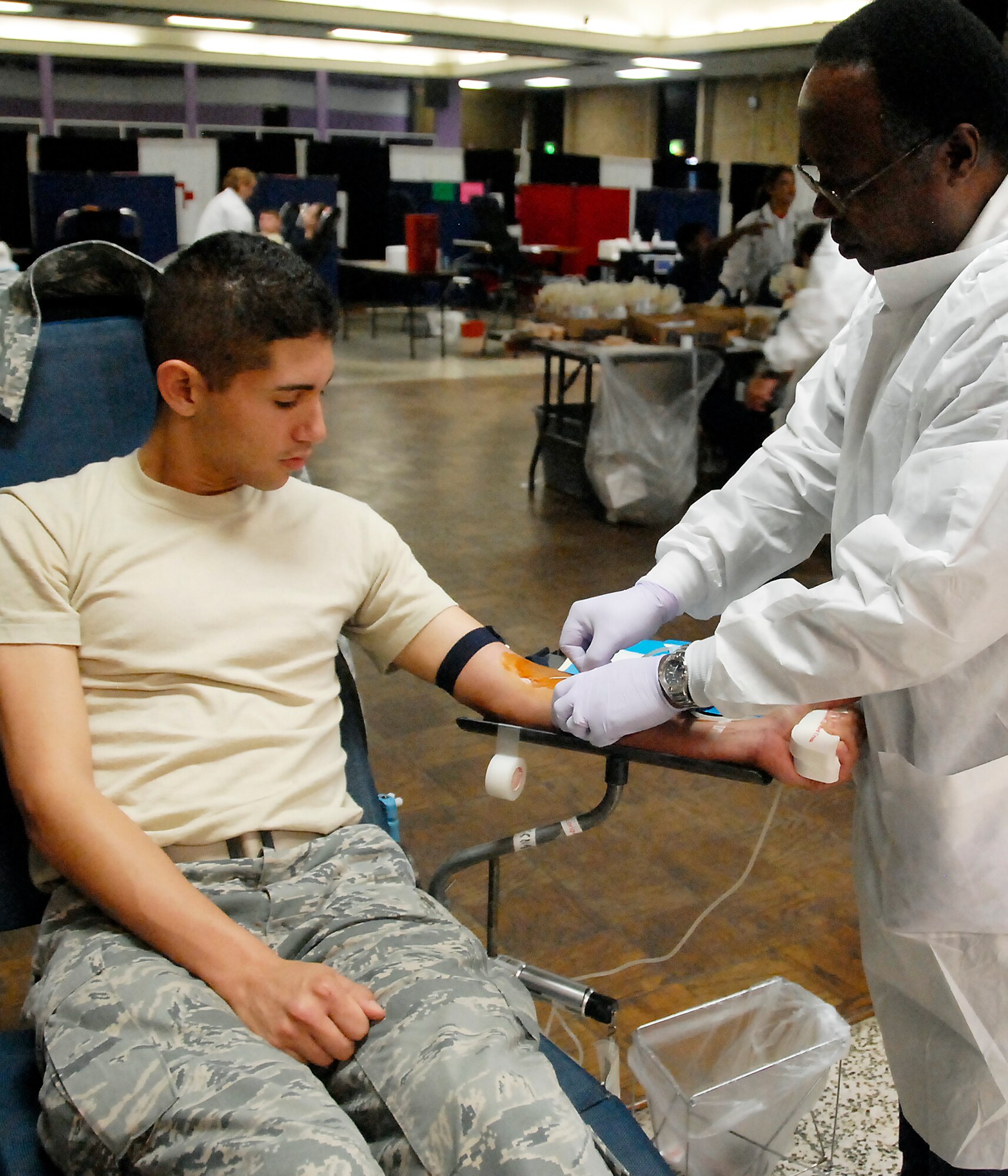 Airman 1st Class Juan Carlos, an Airman in Training, gives blood at the American Red Cross Blood Drive Sept. 22 at the Airman’s Club. He has given blood more than 20 times. This blood drive was geared to break a state blood donation record. (U.S. Air Force photo/ Mike Litteken)